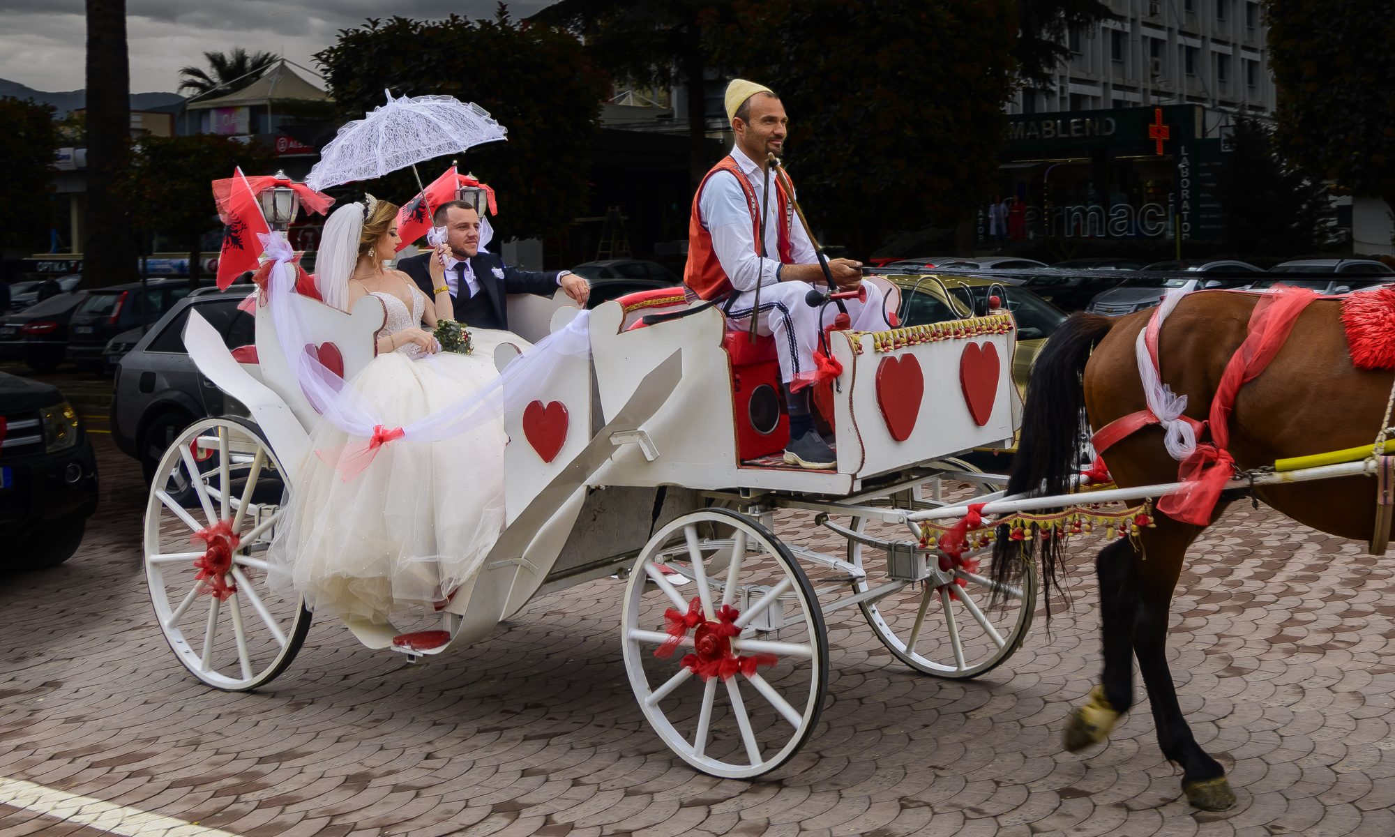 "Newlyweds in a Horse Drawn Carriage"